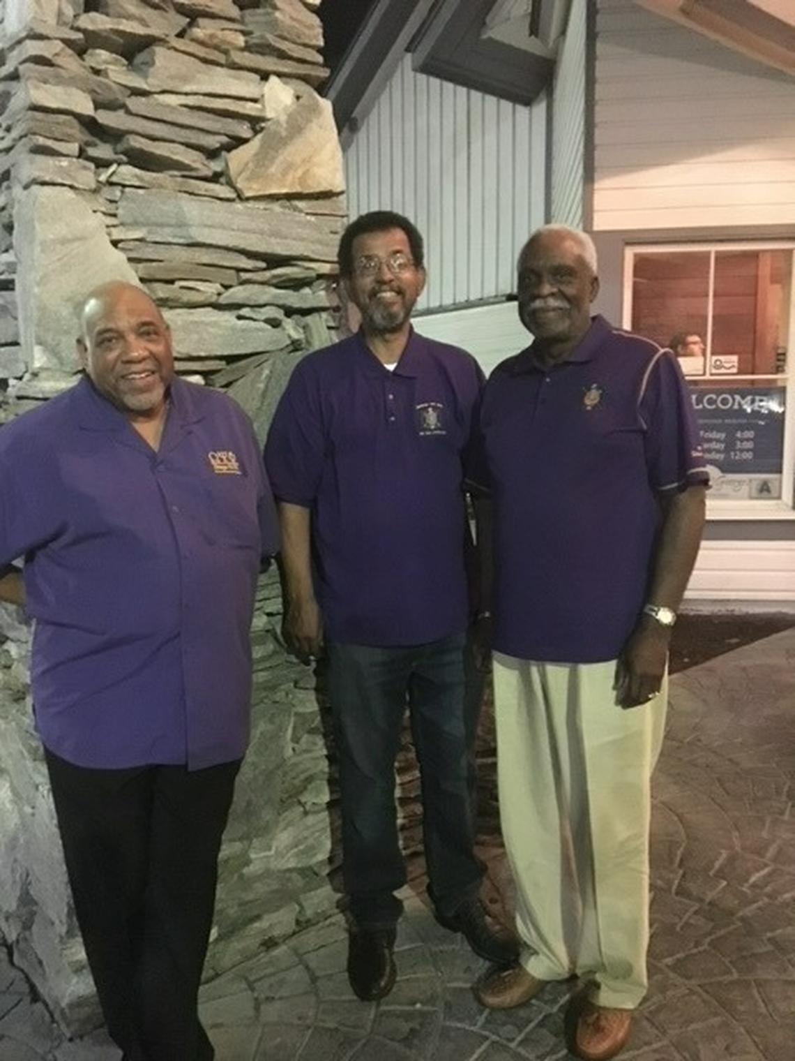 Melvin Pinn, center, poses for a picture with his Omega Psi Phi fraternity brothers, Charles Worth, left, and Sam Reid.