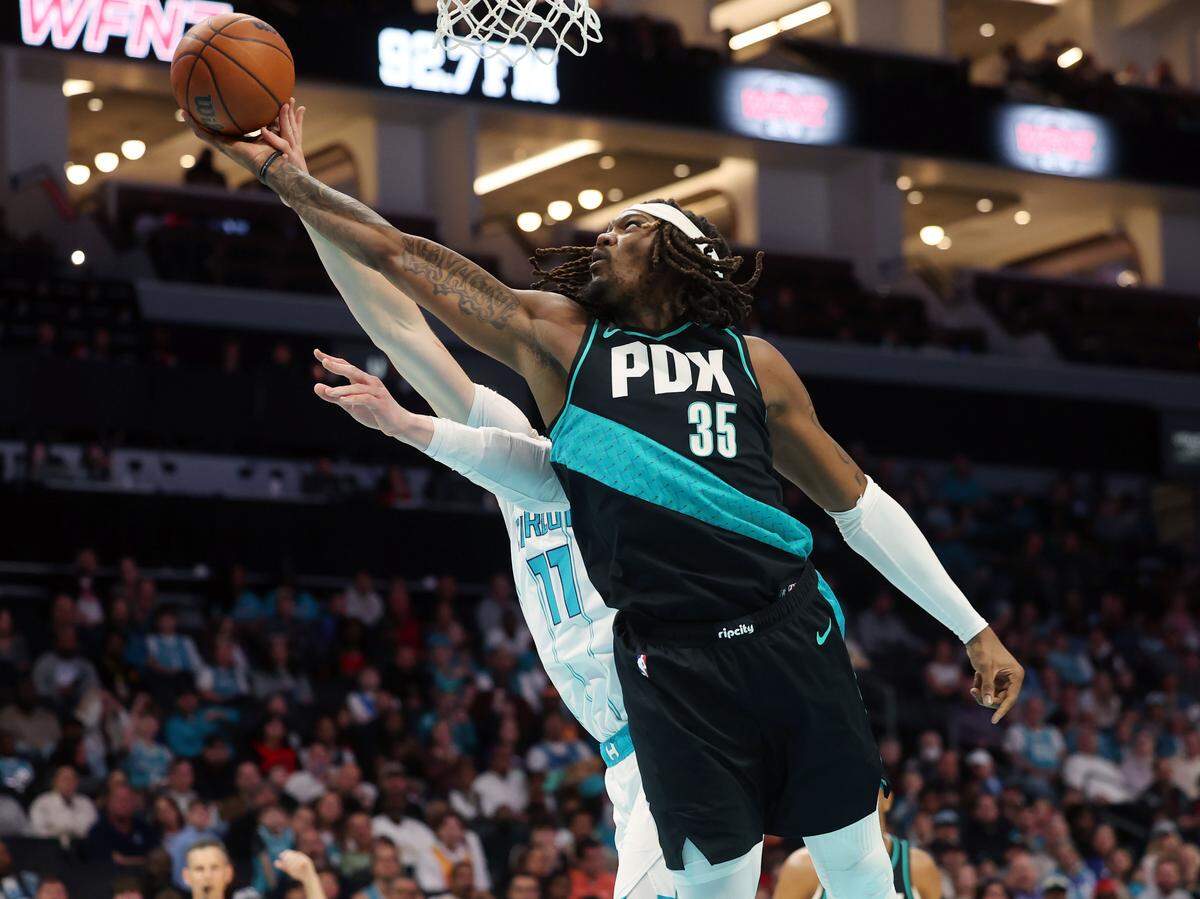 Charlotte Hornets Ryan Kalkbrenner goes up for the shot as Portland Trail Blazers Robert Williams III reaches for the ball during the first quarter of the game against the Portland Trail Blazers Saturday, Feb. 28, 2026 at Spectrum Center in Charlotte.