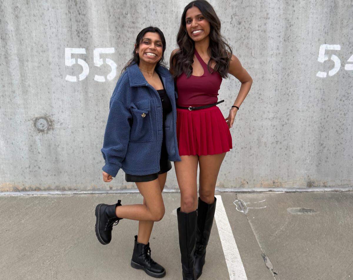 Aespa fans pose for pictures prior to the show in Charlotte.