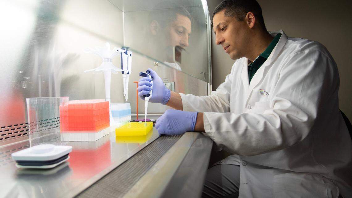 Danillo Augusto works in his lab in Woodward Hall on the Campus of UNC Charlotte. Augusto helped lead a study with two other professors into why some people caught COVID and evaded symptoms.