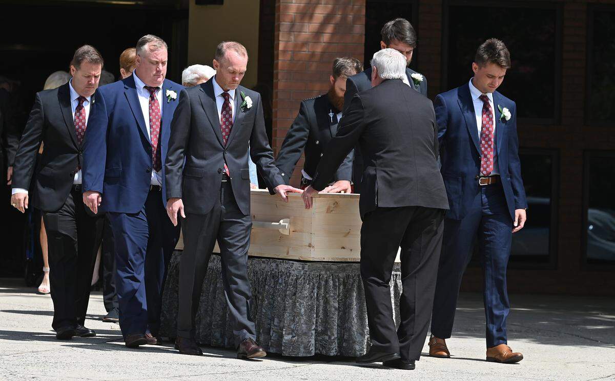Pallbearers exit St. Gabriel Catholic Church in Charlotte with the casket of H.A. “Humpy” Wheeler, Jr., on Tuesday, August 26, 2025. Al legendary promoter for events at the speedway and was described as the “P.T. Barnum of motorsports.” 