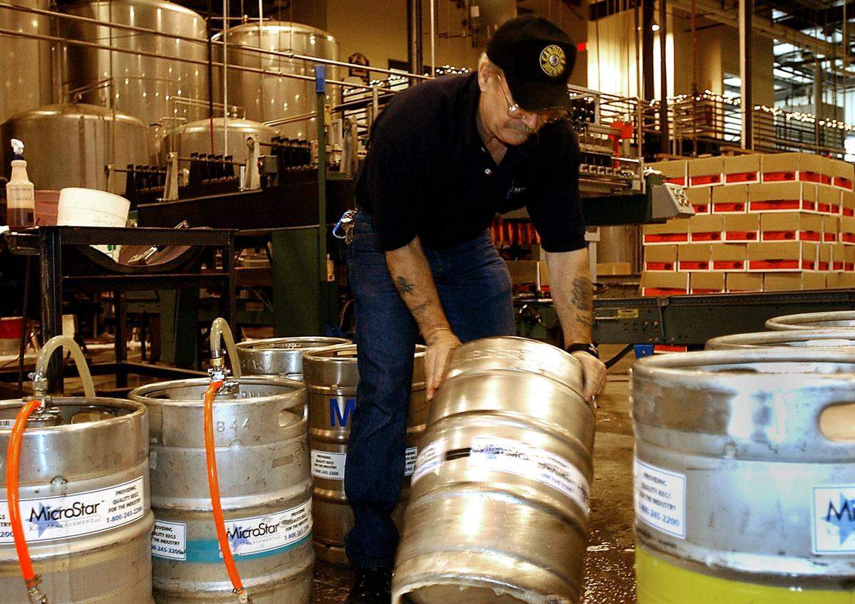 In this 2003 file photo, a Mooresville worker at Carolina Beer & Beverage fills and sorts kegs of Appalachian Ale, a specialty brew made for a client in Boone. The company, now known as Carolina Beverage Group, is dealing with a chemical explosion at its site that left one dead and another person injured Tuesday, April 7.