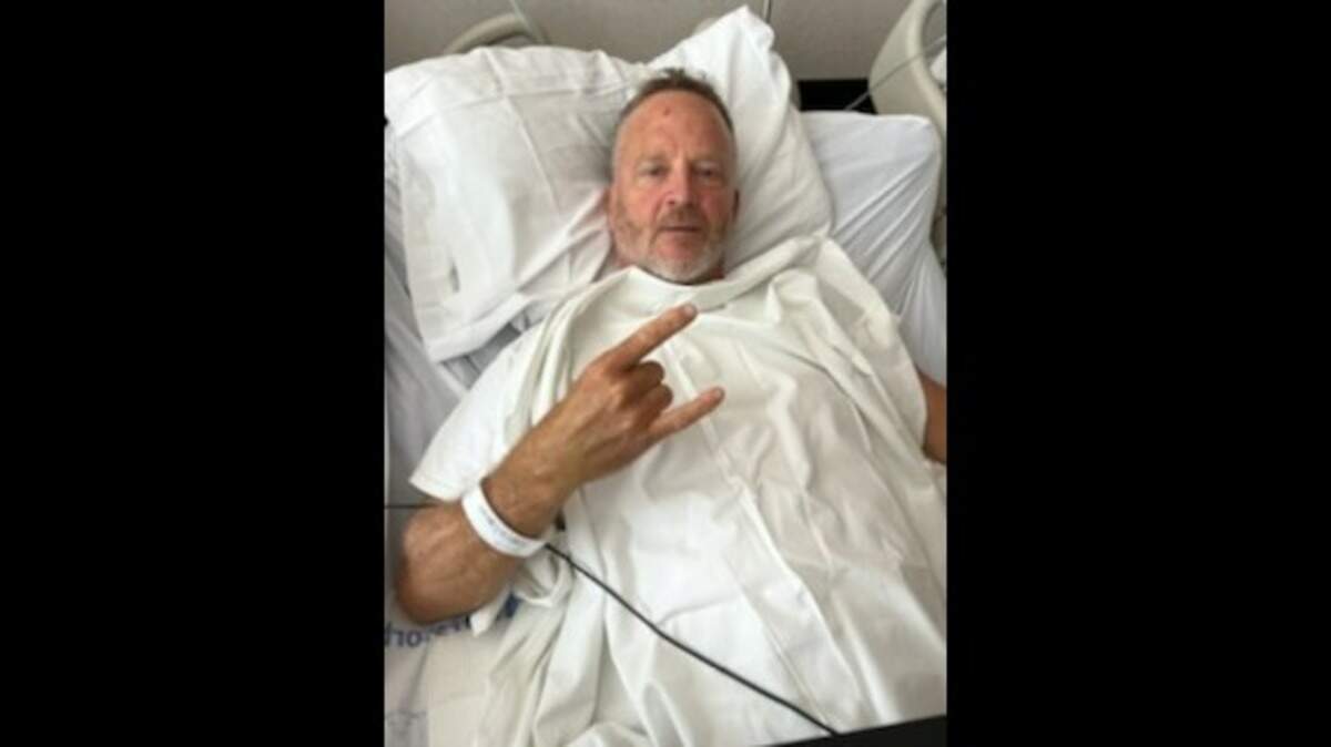Retired Charlotte Fire Captain Tripp Fincher is shown in his hospital bed in Wichita, Kansas.