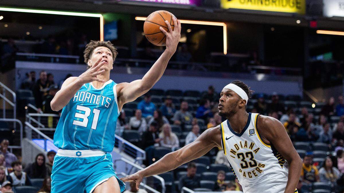 Charlotte Hornets forward Tidjane Salaun (31) shoots the ball while Indiana Pacers center Myles Turner (33) defends in the second half at Gainbridge Fieldhouse.