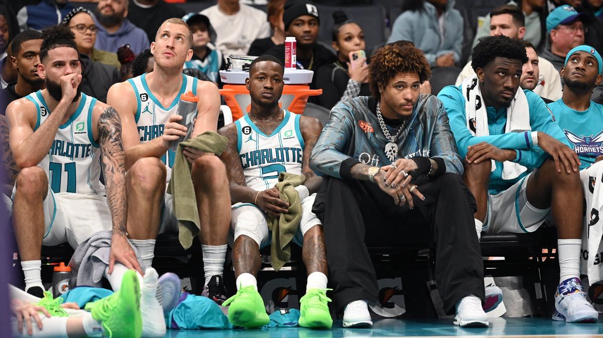 (L-R) Charlotte Hornets forward Cody Martin, center Mason Plumlee, guard Terry Rozier, forward Kelly Oubre Jr., center Mark Williams and forward Jalen McDaniels sit on the team’s bench in the closing moments of second half action against the Memphis Grizzlies on Wednesday, January 4, 2023 at Spectrum Center in Charlotte, NC. The Grizzlies defeated the Hornets 131-107.