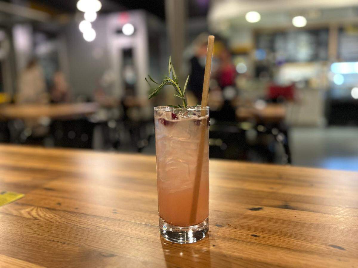 Elizabeth’s Dilworth Story, a new cocktail at The People’s Market, contains gin, cran cinnamon, lime, rosemary and soda.