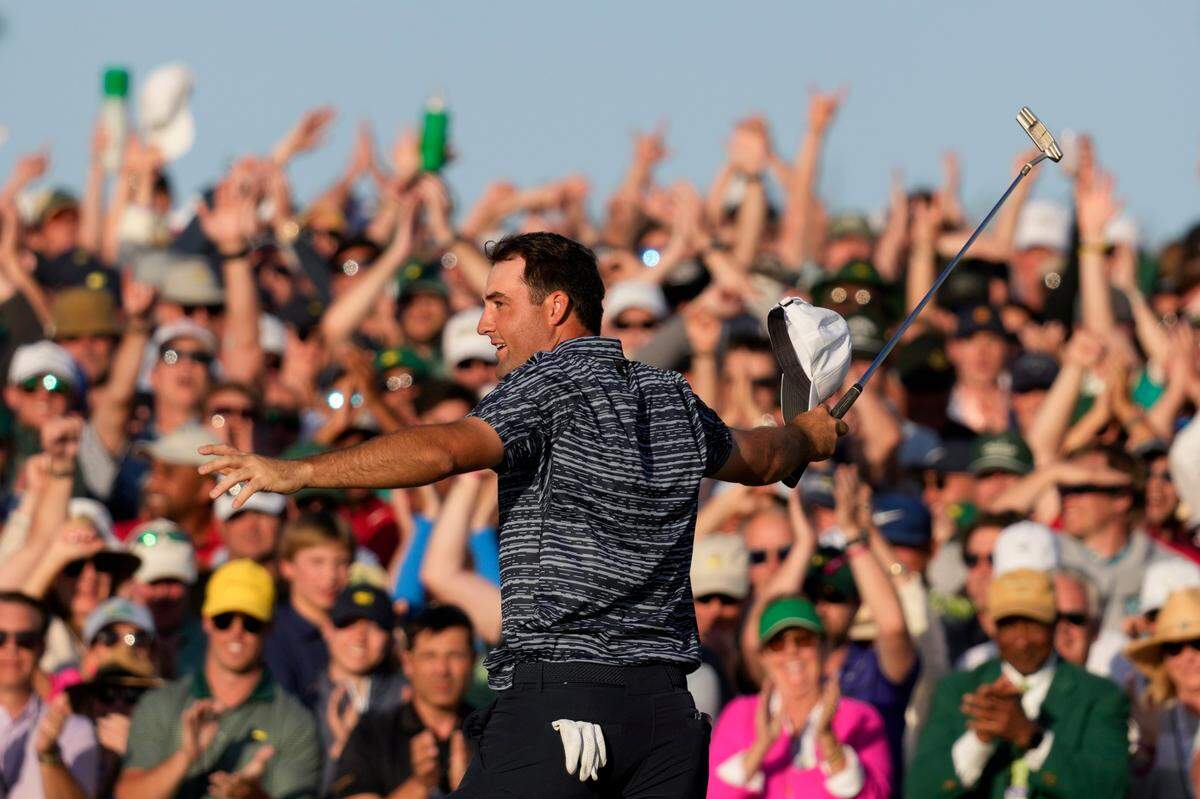 Scottie Scheffler celebrates after winning the 86th Masters golf tournament on Sunday, April 10, 2022, in Augusta, Ga. (AP Photo/Charlie Riedel)