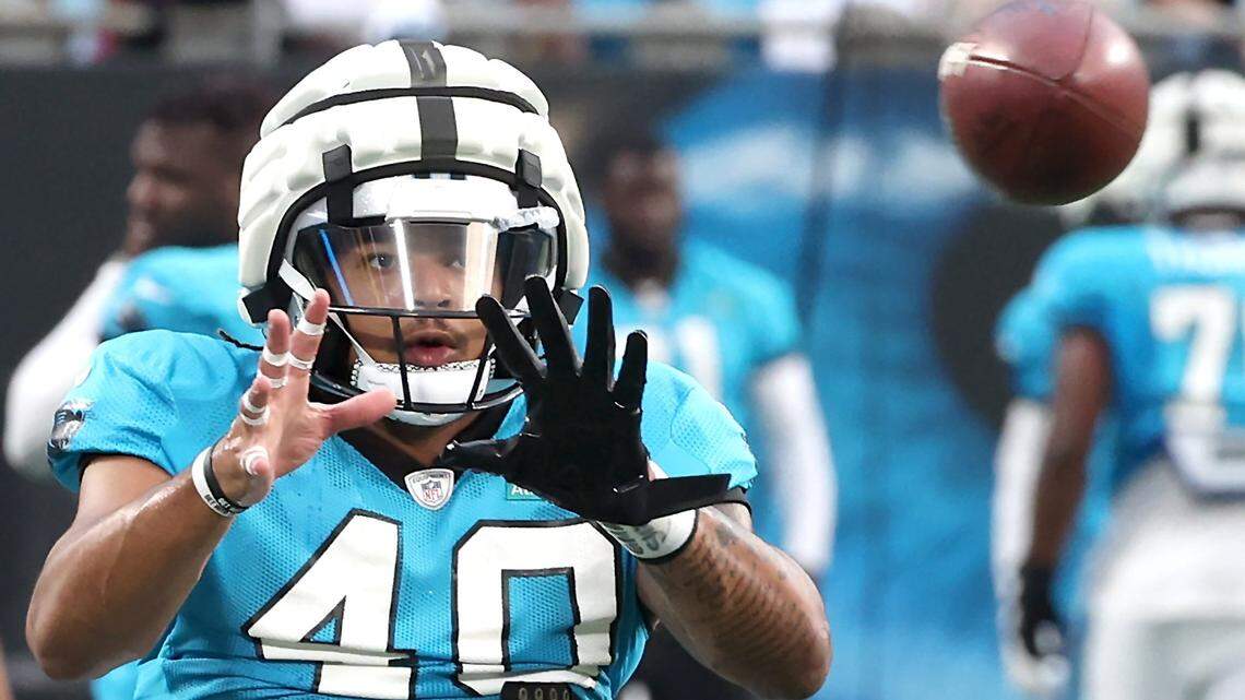 Carolina Panthers linebacker Brandon Smith keeps his eyes on the ball as he runs through a drill during the team’s Fan Fest practice at Bank of America Stadium on Wednesday, August 2, 2023.