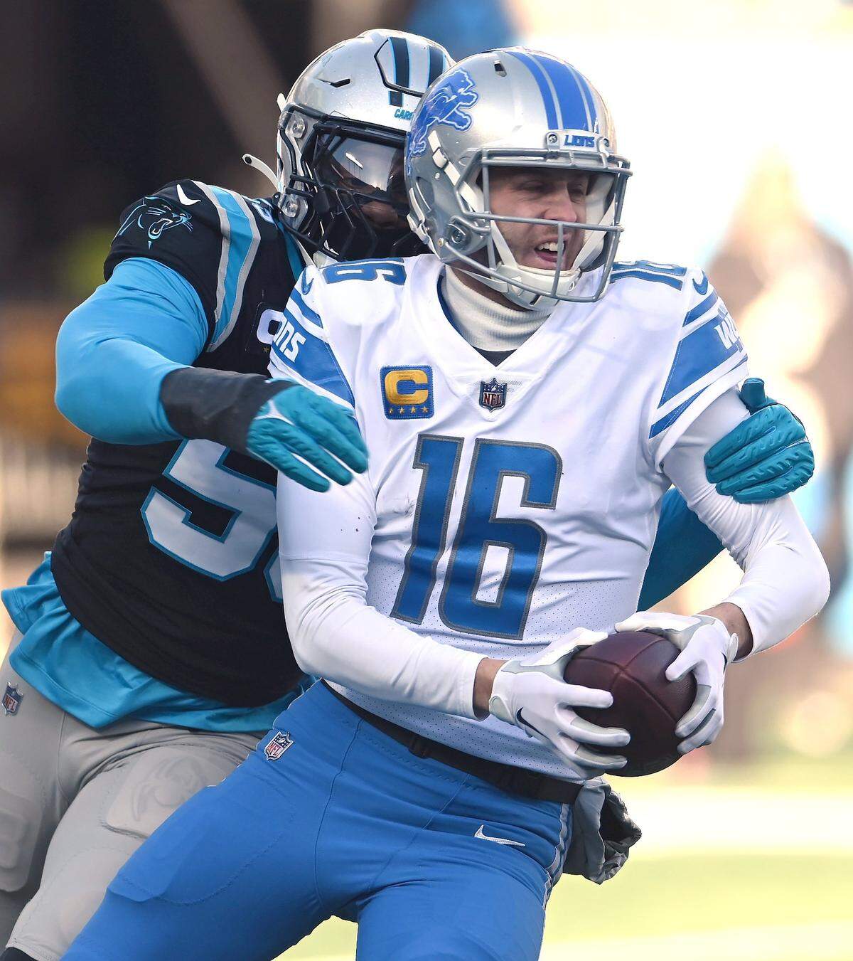 Carolina Panthers defensive end Brian Burns, left, sacks Detroit Lions quarterback Jared Goff, right, during third quarter action at Bank of America Stadium on Saturday, December 24, 2022 in Charlotte, NC. The Panthers defeated the Lions 37-23 on a field that linebacker Shaq Thompson described as feeling like “concrete.”
