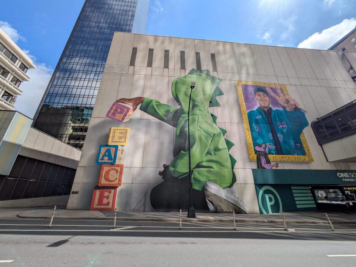 These giant works by artists Darion Fleming (DaFlemingo), left, and TreazyTreaz and Sydney Duarte (Traveling Gypsy), are on East 4th Street in Charlotte, near the entrance of Luminous Lane.