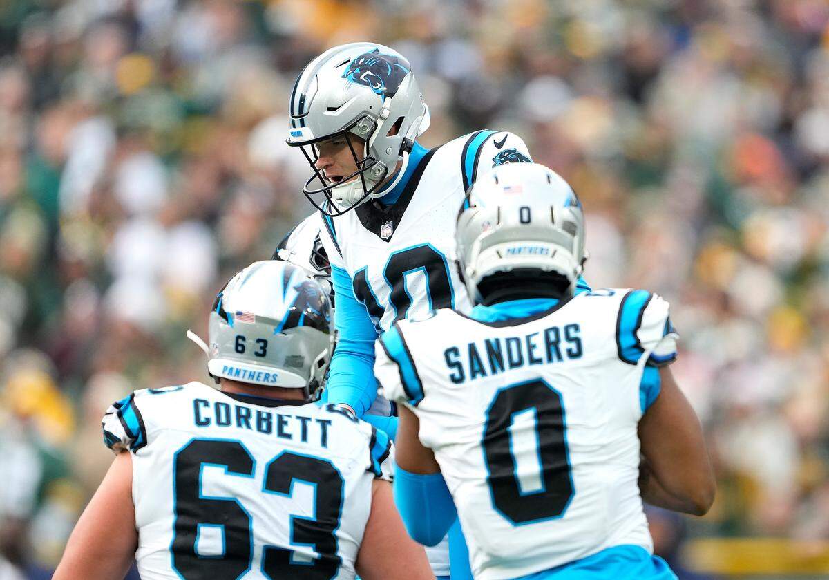 Ryan Fitzgerald of the Carolina Panthers celebrates with teammates after kicking the game winning field goal during the fourth quarter in the game at Lambeau Field on November 02, 2025 in Green Bay, Wisconsin.