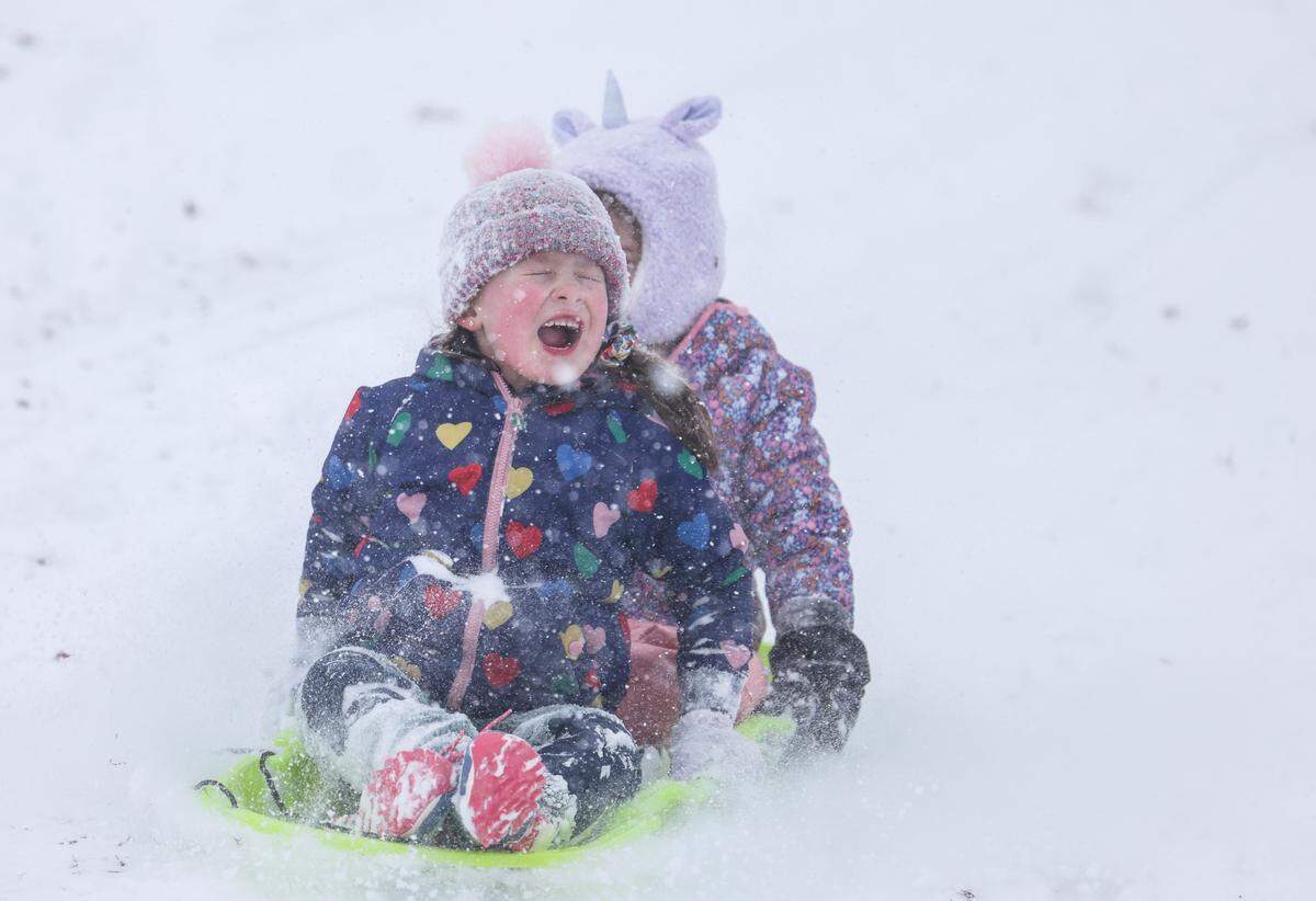 People sled in Cordelia Park in Charlotte, N.C., on Saturday, January 31, 2026.