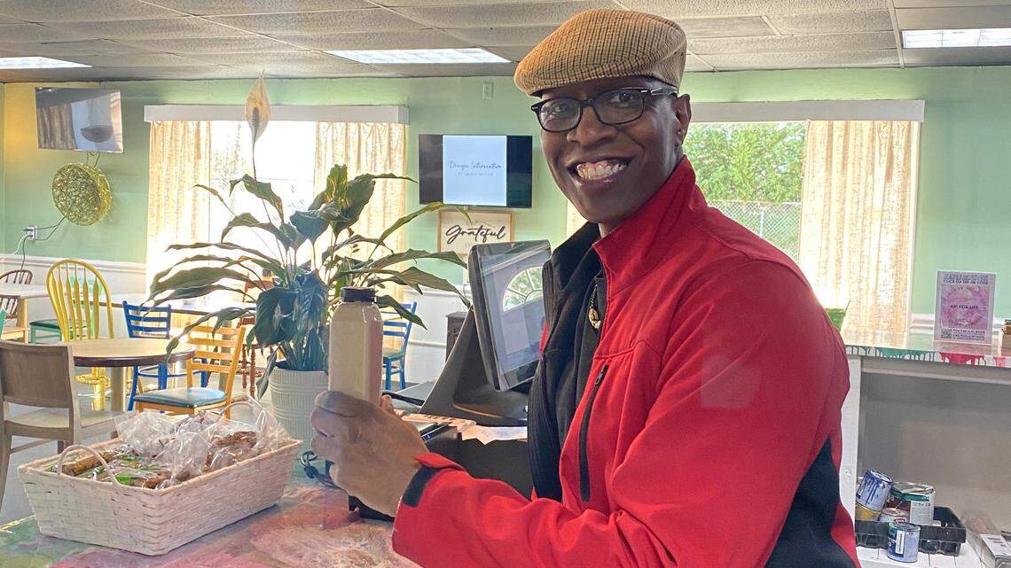 Joseph Butler, one of the partners with Love in Action Cafe and a co-founder of Love is Love Always, works behind the counter.