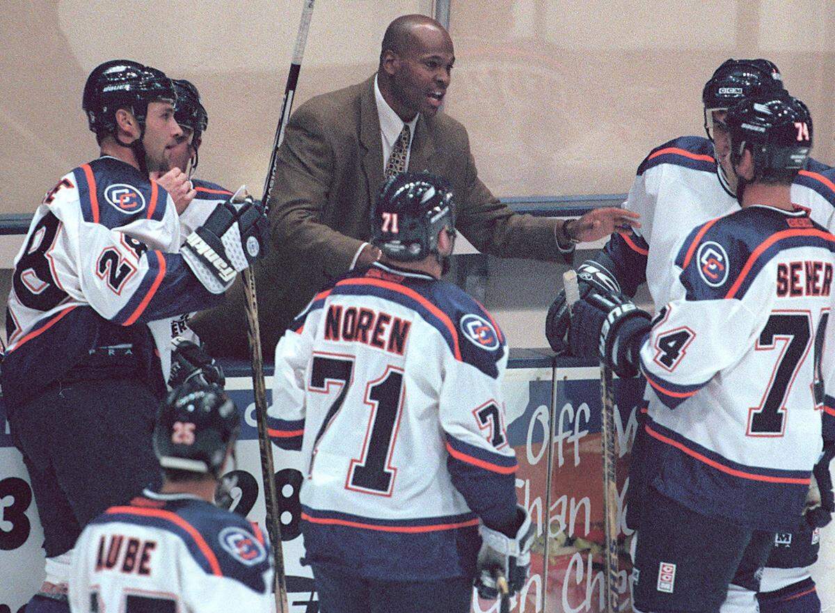 In 1998, then-Charlotte Checkers Head Coach Shawn Wheeler speaks with his players during a break in the action against the Florida Everblades at Independence Arena.
