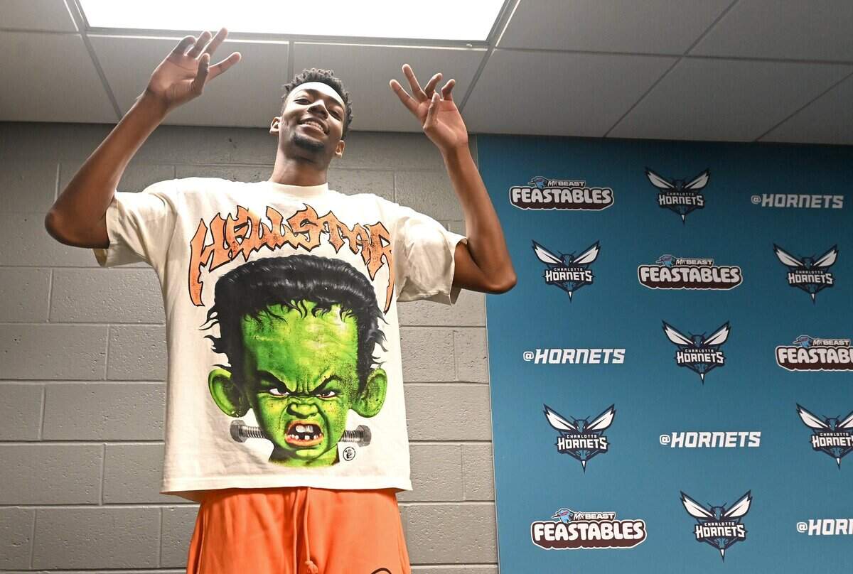 Charlotte Hornets guard/forward Brandon Miller strikes a pose as he leaves the stage following an interview with local media at Spectrum Center on Monday, April 15, 2024.