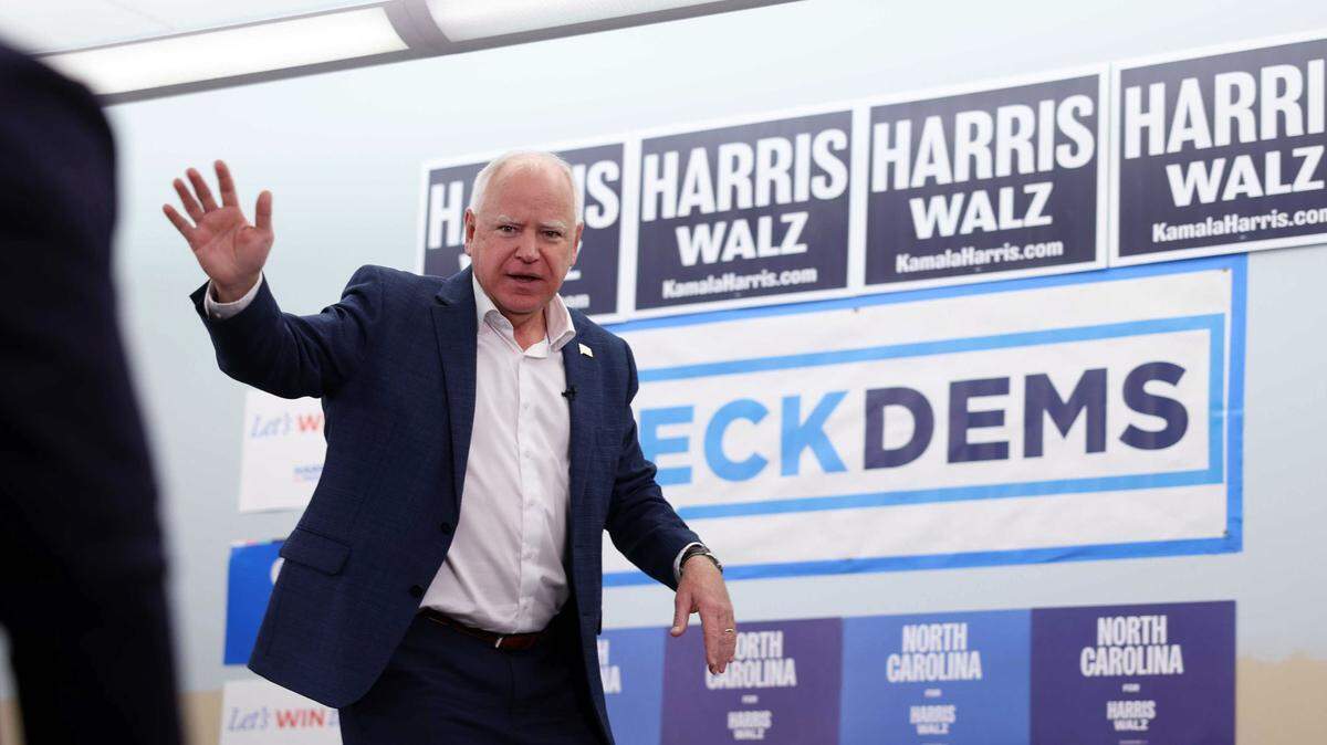 Governor Tim Walz greets supporters at the launch of a canvassing operation that spread out Matthews and South Charlotte to get out the vote for Democrats on Wednesday, Oct. 30, 2024 in Matthew, NC