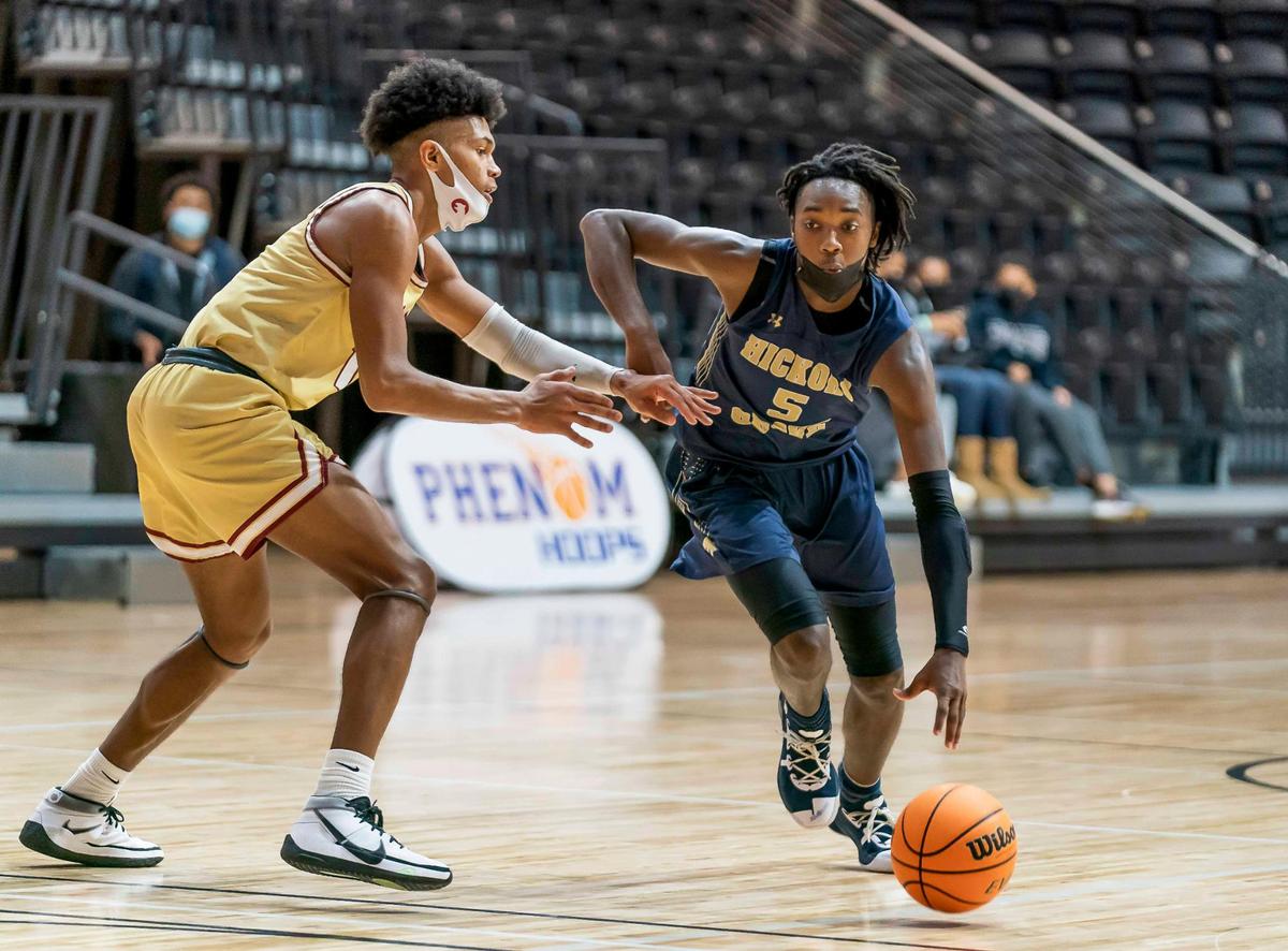 Hickory Grove’s Chas Stinson (5) drives to the basket at the Phenom Holiday Classic Wednesday December 23, 2020.