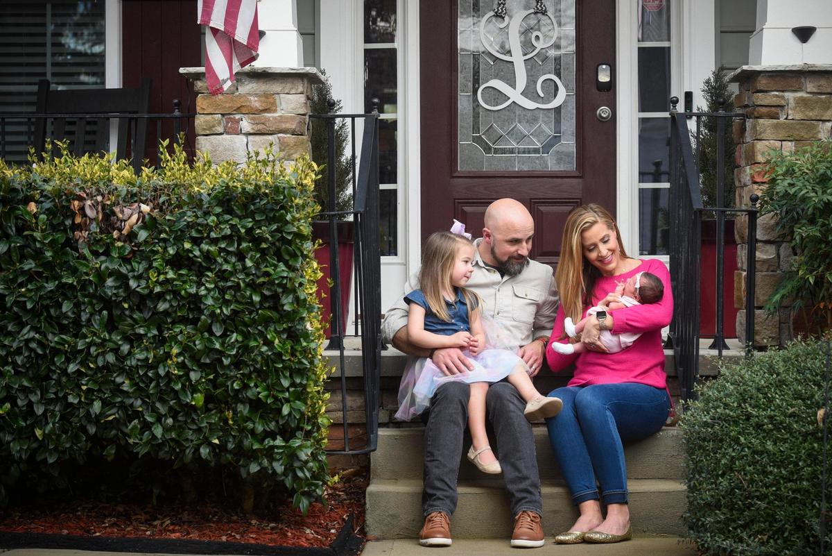 From left, Hope Lucas, Josh Lucas, Allison Latos and Helena Lucas, photographed on the front steps of their home in Belmont, one week after Helena’s birth. And in case you’re wondering: Allison plans to return to the anchor desk at WSOC this spring, after enjoying 12 weeks of maternity leave.