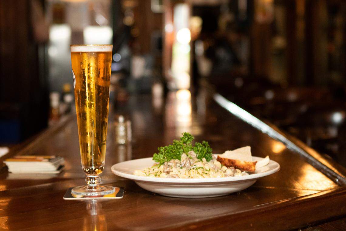 Beer and Stroganoff at the bar at Alexander Michael’s in Uptown Charlotte. Al Mike’s is located in Fourth Ward uptown Charlotte.