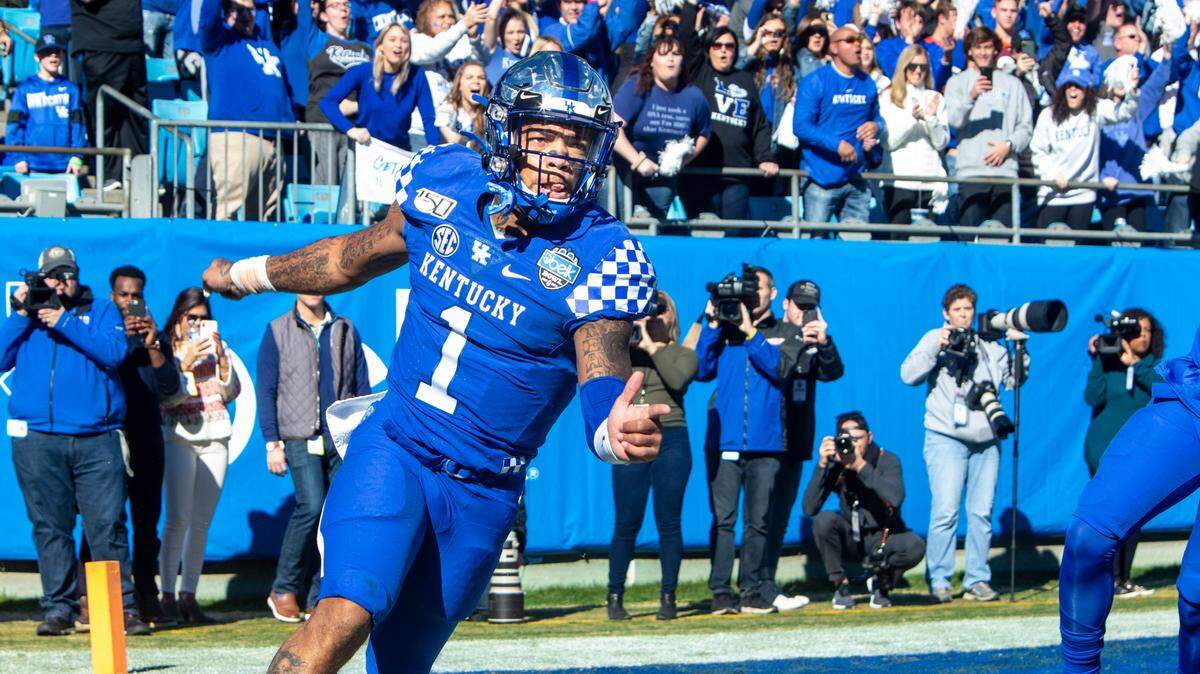 Kentucky’s quarterback Lynn Bowden Jr. celebrates after running the teams first touchdown against Virginia Tech during the Belk Bowl at the Bank of America Stadium in Charlotte, NC on Tuesday, December 31, 2019.