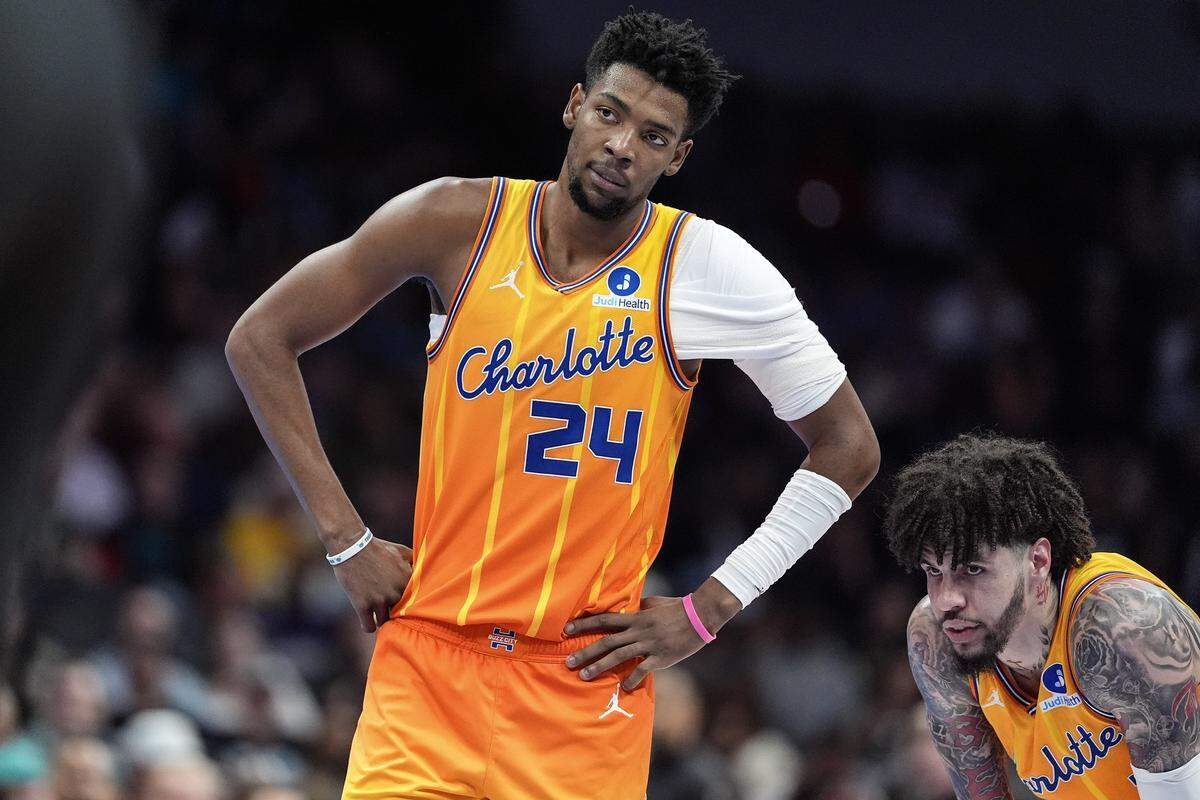 Charlotte Hornets forward Brandon Miller and Charlotte Hornets guard LaMelo Ball look on during the second half of a game against the Cleveland Cavaliers on Feb. 20, 2026, in Charlotte, North Carolina.