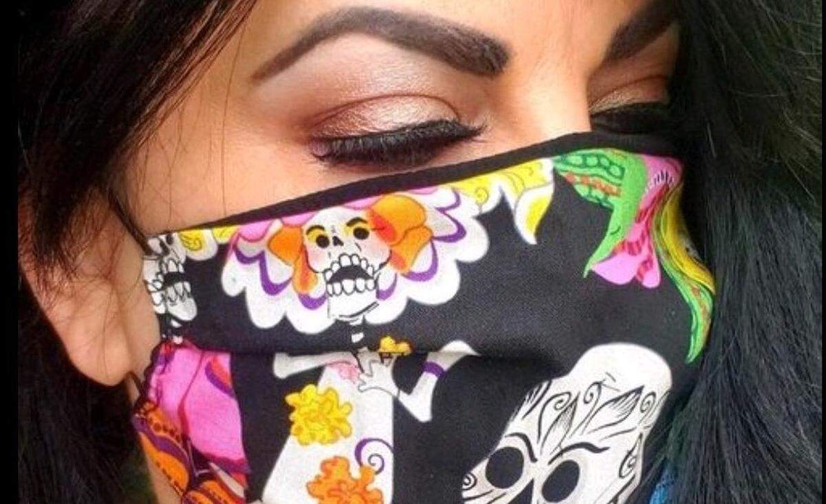Kymm McLean, owner of Who’s the Fairest, made her mask from fabric she had in storage.