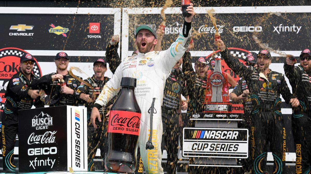Austin Dillon celebrates in Victory Lane after winning a NASCAR Cup Series auto race at Daytona International Speedway, Sunday, Aug. 28, 2022, in Daytona Beach, Fla. (AP Photo/Phelan M. Ebenhack)