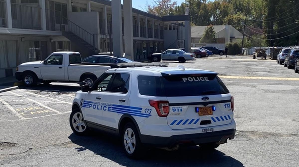 In this image from WSOC, a Charlotte-Mecklenburg police vehicle blocks the parking lot of the Southern Comfort Inn on Tuckaseegee Road on Friday, Oct. 7, 2022.