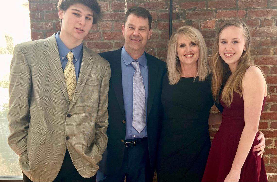 Jamie Seitz (second from left) was a beloved teacher and coach at Lincoln Charter School in Denver, N.C. He died from COVID-19 on Dec. 27, 2020 at age 51. From left is Seitz’s family: Son Carter, Jamie, wife Liz and daughter Peyton.