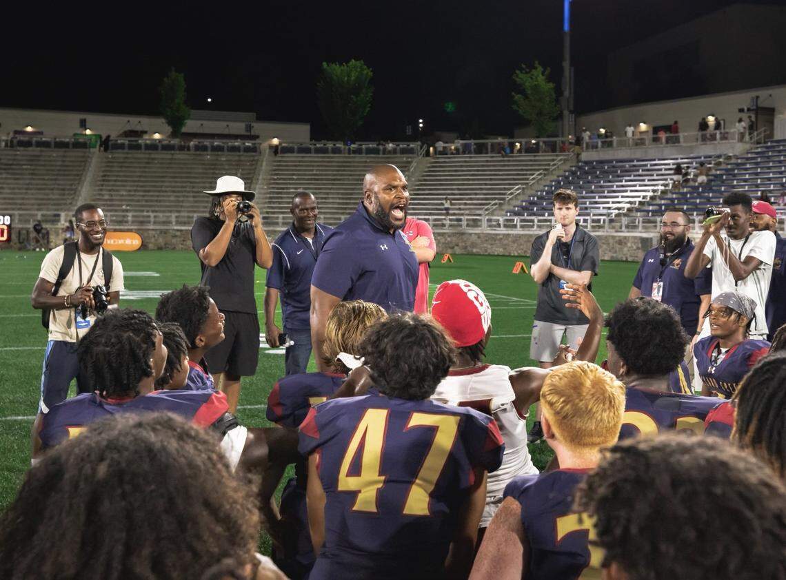 Mallard Creek coach Kennedy Tinsley addresses his team following last week’s 28-14 win over Independence