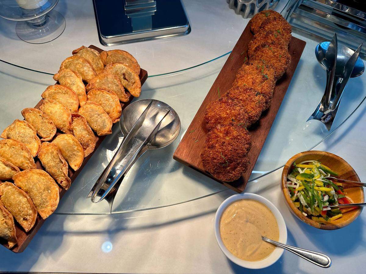 Pan-seared shrimp cakes and beef empanadas available at Spectrum Center in Charlotte.
