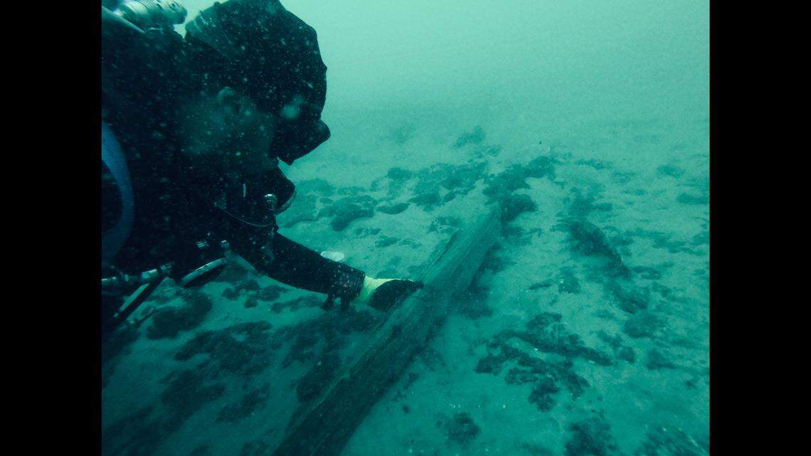 Divers with Blue Water Ventures International pick through the debris at the shipwreck of the Steamship North Carolina off South Carolina.