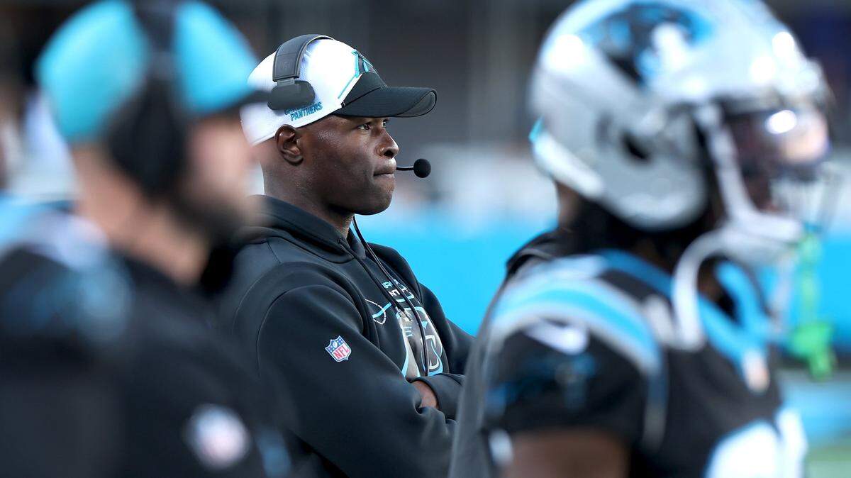 Carolina Panthers Ejiro Evero, center, watches the team battle the Dallas Cowboys during second half action at Bank of America Stadium in Charlotte, NC on Sunday, November 19, 2023. The Cowboys defeated the Panthers 33-10.