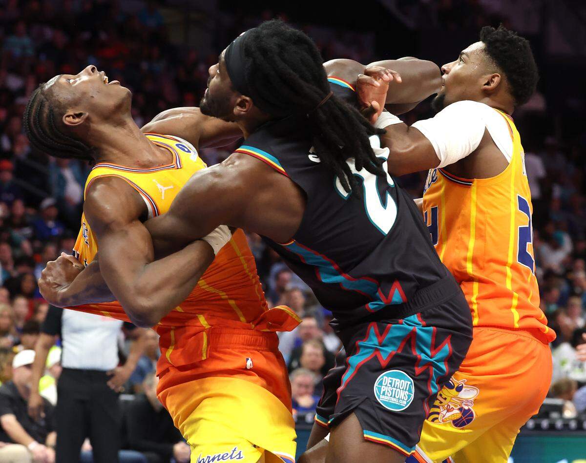 Charlotte Hornets forward/center Moussa Diabate, left, and guard Brandon Miller battle Detroit Pistons center Isaiah Stewart on Friday. The Pistons defeated the Hornets 118-100, outscoring Charlotte 25-10 in the fourth quarter.