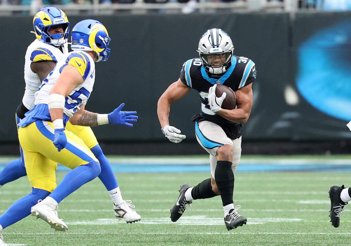 Carolina Panthers running back Chuba Hubbard carries the ball for some of his 124 total yards against the L.A. Rams on Sunday.