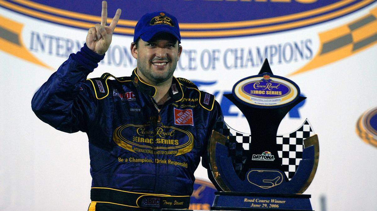 FILE - In this June 26, 2006, file photo, Tony Stewart poses with the trophy after winning the Crown Royal IROC auto race in Daytona Beach, Fla. The IROC Series, where the best drivers from various disciplines raced each other in equally prepared cars, ran for 30 seasons before Tony Stewart won its final championship in 2006 and the series quietly went away. Now Stewart, along with fellow NASCAR Hall of Famer Ray Evernham, has teamed with a group of heavyweights to bring an all-star circuit back in 2021. The Superstar Racing Experience plans a six-race, short-track series to air in prime-time on CBS in a Saturday night summer spectacular. (AP Photo/Paul Kizzle, File)