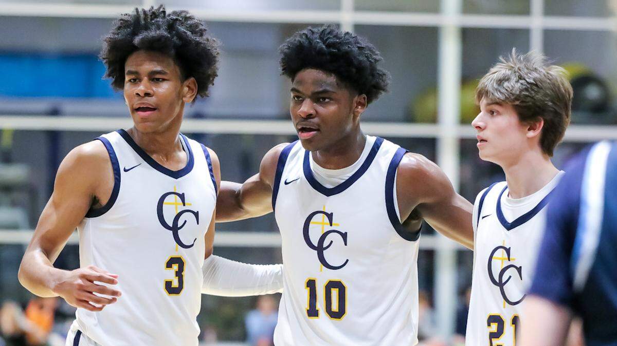 Carmel Christians Bryce Cash gathers his teammates to discuss a play