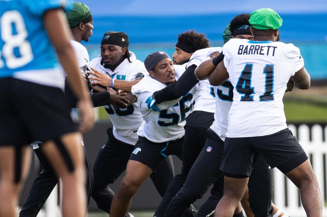 Carolina Panthers Trevin Wallace, center, runs a drill during the Carolina Panthers Training Camp in Charlotte, N.C., on Monday, August 5, 2024.