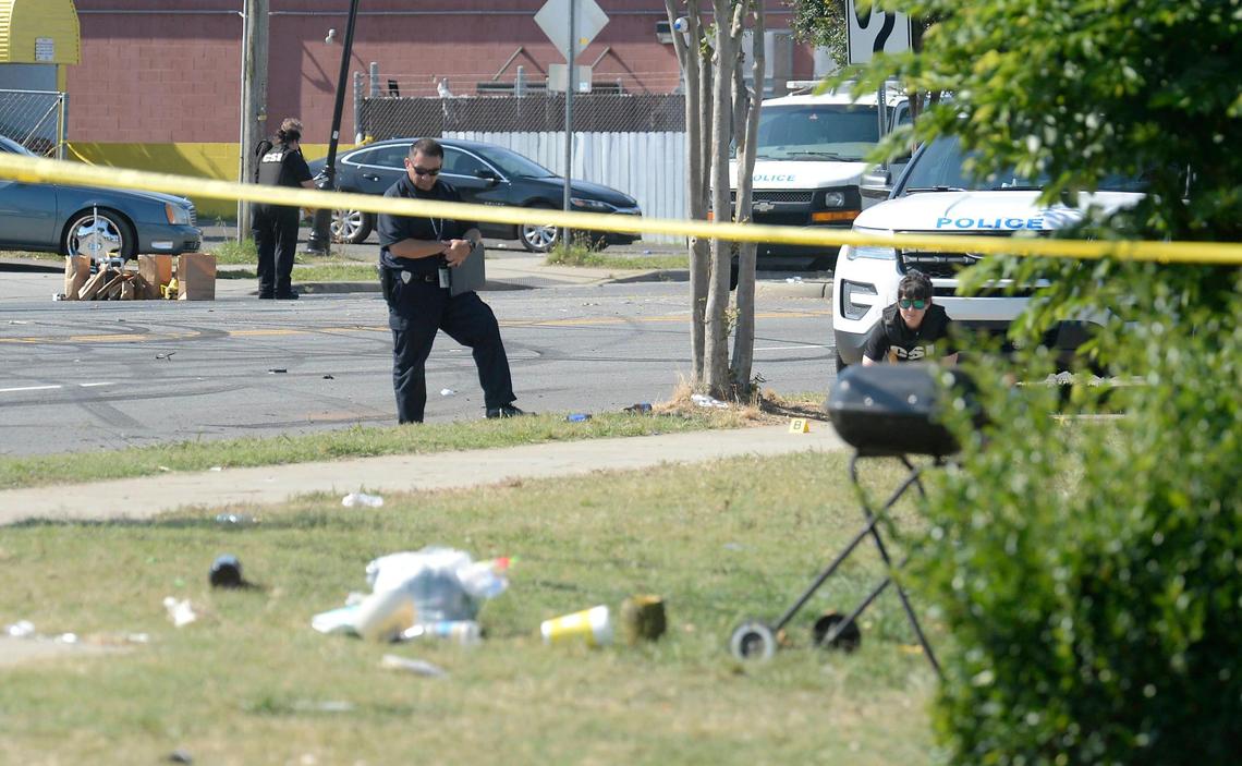 Charlotte-Mecklenburg Police CSIs investigate the aftermath of a shooting along Beatties Ford Road near Catherine Simmons Avenue on Monday, June 22, 2020. Two people were killed and at least a dozen were hurt late Sunday after a street party erupted in gunfire in the the 1800 block of Beatties Ford Road in Charlotte, Charlotte-Mecklenburg Police say. Multiple people were hit by vehicles.