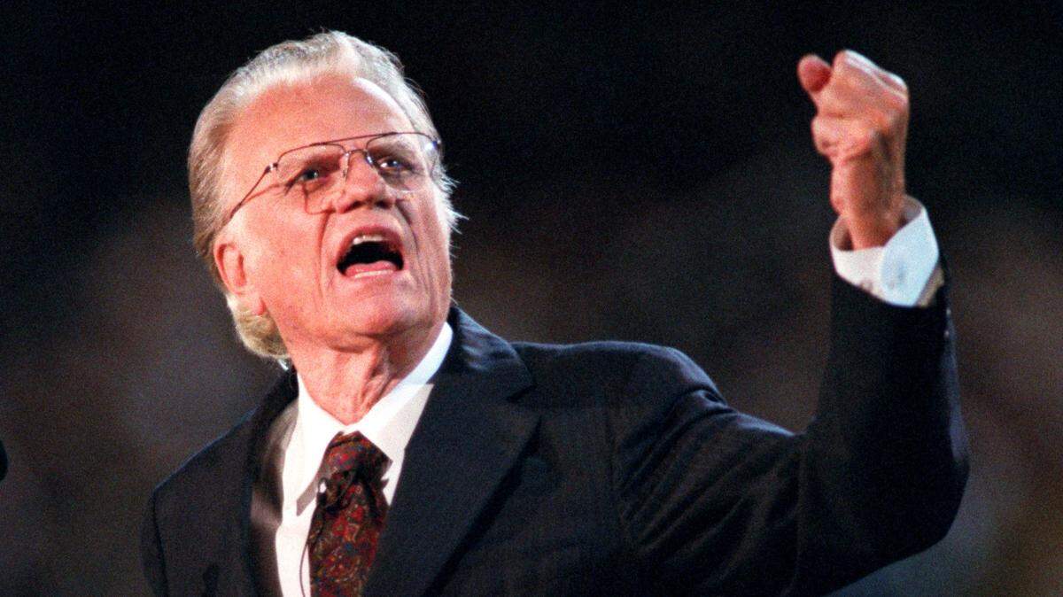 Billy Graham talks to a Charlotte crowd in 1996.