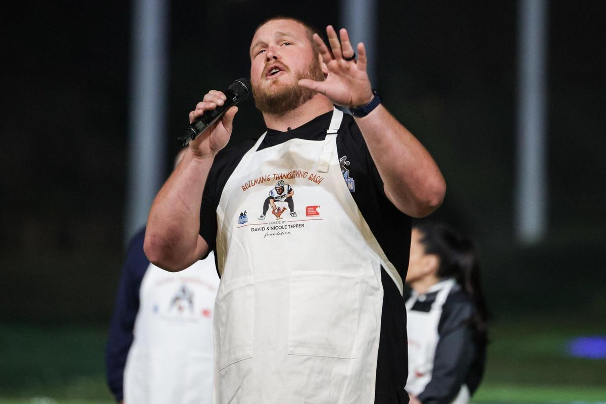 Panthers center Bradley Bozeman welcomes kids to Bozeman’s Thanksgiving bash at Topgolf on Monday, November 20, 2023 in Charlotte, NC. The David and Nicole Tepper Foundation teamed up with Panthers offensive lineman, Bozeman, and his wife, Nikki, to feed more than 1,200 kids.