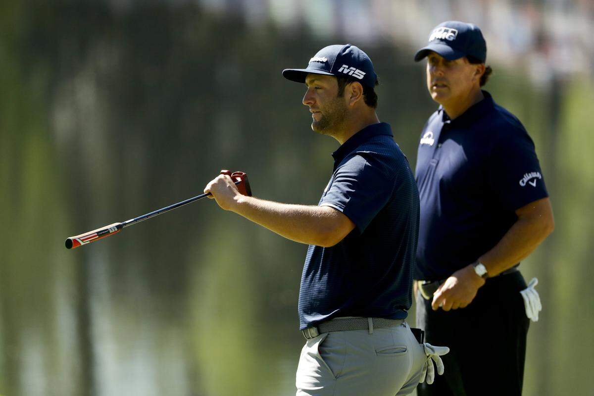 Phil Mickelson, shown with Jon Rahm, could become the oldest ever winner of the Masters this week. (AP Photo/Matt Slocum)