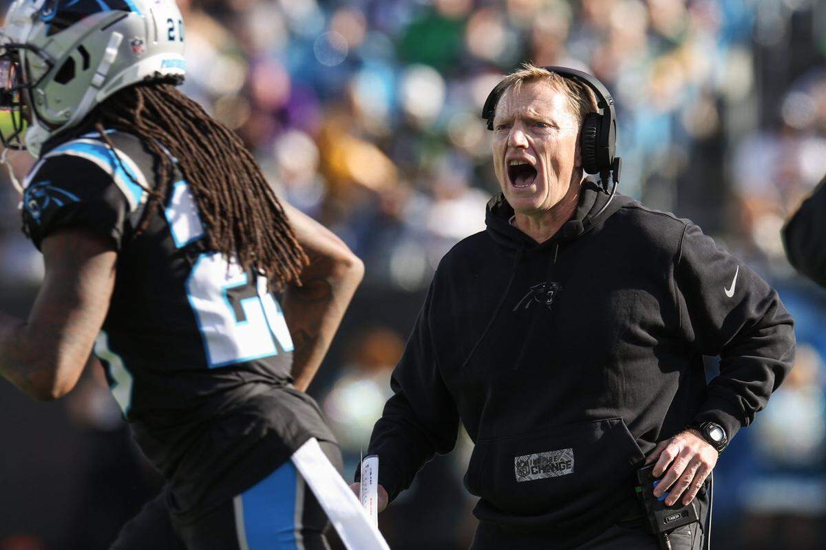 Panthers head coach Chris Tabor yells to the defense as they take the field during the game against the Packers at Bank of America Stadium on Sunday, December 24, 2023.