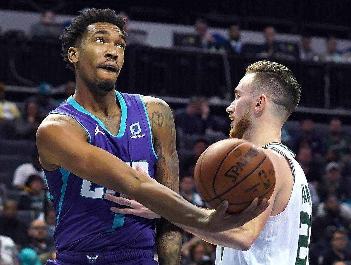 Charlotte Hornets guard Malik Monk, left, drives to the basket against Boston’s Gordon Hayward. Monk drove the ball to the basket more often in 2019-20, resulting in a modest boost of his scoring average, to 10.3.