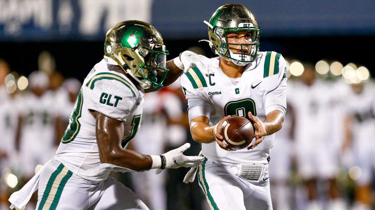 Charlotte 49ers quarterback Chris Reynolds (3) hands off the ball to running back Shadrick Byrd (13) last Friday at Florida International. The 49ers enter their bye week at 4-2.