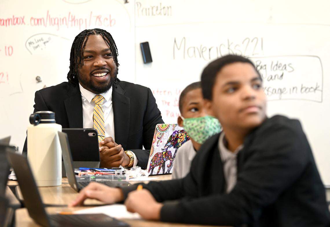 Kenneth Gorham, left, listens in on a sixth grade class on Tuesday, January 10, 2023. Gorham is the principal of Movement Freedom Middle School in Charlotte, NC. Gorham is only 25 years old and is the youngest principal in the charter school’s history.