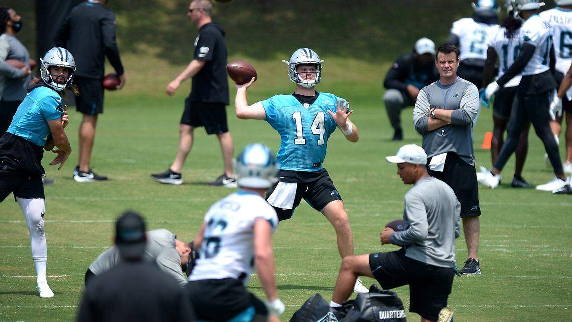 Carolina Panthers quarterback Sam Darnold, center, passes to a receiver during the teamÕs OTA practice on Tuesday, May 25, 2021.