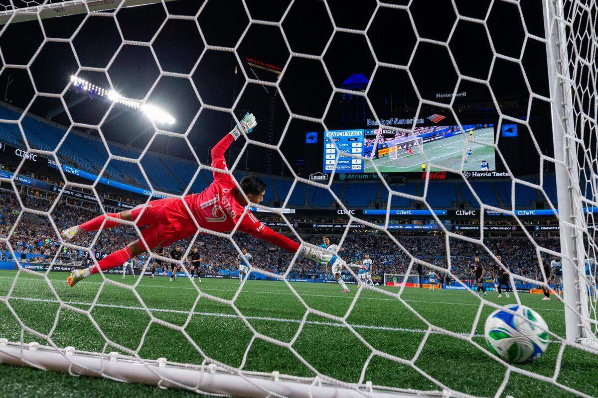 Charlotte FC forward Idan Toklomati (17) scores against Inter Miami goalkeeper Óscar Ustari (19) on a penalty kick in Saturday’s second half at Bank of America Stadium. 