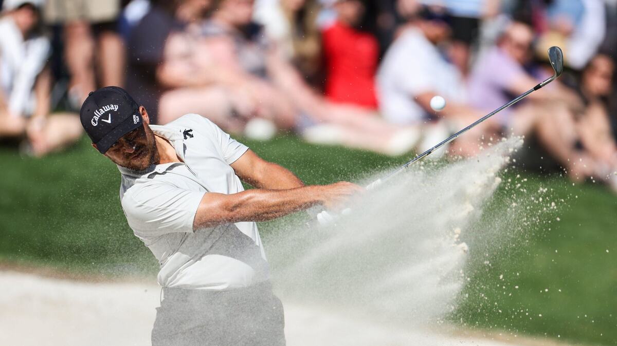 Xander Schauffele hits from.a bunker on the 15th hole during round three of the Wells Fargo Championship at Quail Hollow Club in Charlotte, N.C., on Saturday, May 11, 2024.