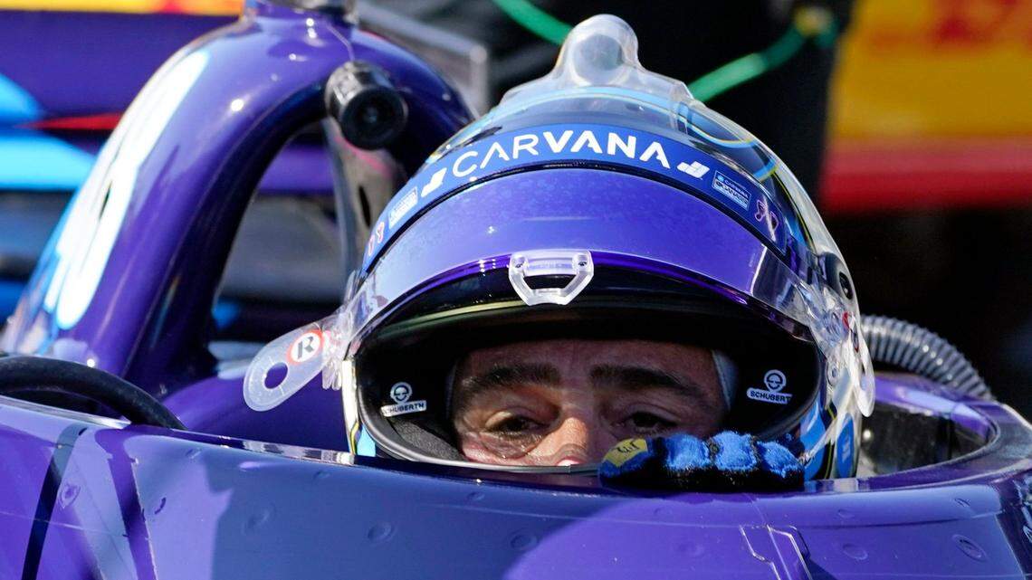 Jimmie Johnson climbs out of his car following practice for the IndyCar auto race at Indianapolis Motor Speedway in Indianapolis. Johnson told The Observer he’s open to driving in the Indy 500 next year and driving in NASCAR again.